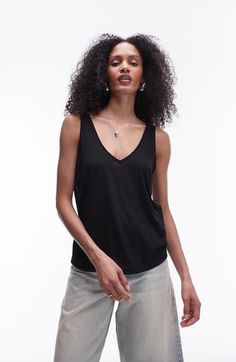 Made from lightweight jersey, this V-neck tank has a slouchy fit that's great for layering or letting the breeze in on hot days. V-neck 50% viscose, 50% polyester Machine wash, line dry Imported Versatile V-neck Tank Top For Everyday, Versatile V-neck Tank Top For Summer, Black V-neck Tank Top For Layering, Stretch V-neck Camisole For Layering, Versatile V-neck Tank Top, Casual V-neck Tank Top For Layering, Casual V-neck Tank Top For Everyday, Versatile Everyday V-neck Tank Top, Chic Viscose V-neck Tank Top