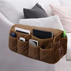 an open purse sitting on top of a white couch