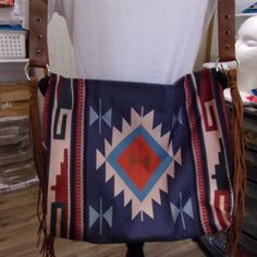 Nwt: Southwestern Tribal Style Purse Done In Navy Blue, Orange, Lite Blue And Tan, This Is Not A Expensive Purse I Was Very Disappointed When I Received It, But Maybe Someone Would Like To Have It At A Cheap Price. It Is A 12 X 14, It Has Leather Tassels Hanging Down From Both Side, It Has A Nice Lining With A Zipper, The Handle Is Made Out Of Some Kind Of Thin Material. Gucci Gg Bag, Expensive Purses, Lv Bumbag, Small Canvas Bags, Cowgirl Necklaces, Kate Spade Shoulder Bag, Denim Shoulder Bags, Studded Bag, Michael Kors Crossbody Bag