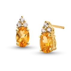 Make their November birthday a magical one with these stunning citrine and diamond stud earrings. 10K gold Each earring features a 6.0 x 4 oval-shaped golden-yellow citrine center stone Trios of diamonds top each center stone 1/10 ct. t.w. of diamonds Post earrings; friction backs 14k Yellow Gold Diamond Gemstone Earrings, Yellow Gold Diamond Gemstone Earrings In 14k, 14k Yellow Gold Diamond Earrings With Gemstone, Yellow Gold Earrings With Gemstone Accents, Yellow Gold Gemstone Diamond Earrings Gift, 14k Yellow Gold Oval Diamond Earrings, 14k Gold Diamond Gemstone Earrings, Yellow Gold Oval Earrings With Prong Setting, Classic Citrine Jewelry With Diamond Accents