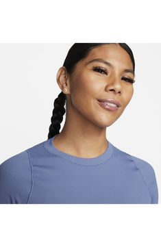 Narrow ribbing adds subtle texture to a slightly cropped top that's ready to elevate your casual look. Crewneck Short sleeves InfinaSoft lightweight fabric 78% nylon, 22% spandex Machine wash, tumble dry Imported Blue Ribbed Athleisure Tops, Sporty Blue Top With Ribbed Neckline, Blue Ribbed Sporty Tops, Ribbed Crew Neck Athleisure Top, Everyday Blue Ribbed Tops, Blue Ribbed Crop Top With Crew Neck, Blue Ribbed Crew Neck Crop Top, Blue Ribbed Tops With Relaxed Fit, Blue Ribbed Top With Relaxed Fit