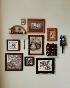 there are many framed pictures on the wall