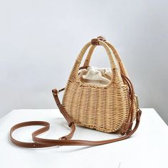 SPECIFICATIONSBrand Name: artmomoHandbags Type: Shoulder BagsTypes of bags: Handbags & Crossbody bagsMain Material: StrawLining Material: CanvasShape: BaguettePlace Of Origin: GUANG DONG ProvincePlace Of Origin: HU NAN ProvinceOrigin: Mainland ChinaCN: HunanHardness: HARDPattern Type: SolidInterior: No PocketDecoration: NONEExterior: Solid BagOccasion: VersatileClosure Type: stringGender: WOMENStyle: fashionNumber of Handles/Straps: Single Summer Portable Brown Straw Bag, Summer Brown Portable Straw Bag, Picnic Shoulder Bag With Adjustable Strap, Spring Straw Crossbody Shoulder Bag, Brown Portable Straw Bag For Daily Use, Portable Brown Straw Bag For Daily Use, Spring Picnic Tote Shoulder Bag, Straw Satchel Shoulder Bag For Spring, Casual Shoulder Bag With Detachable Handle In Straw