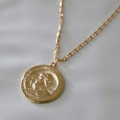 Large vintage french coin medallion with wreath detail on Eleanor link chain Measures 17" with 2" extender 24KT GOLD OVERLAY BRASS CHAIN This is our highest quality of gold plating. Our Gold Overlay jewelry is produced by applying an average of 20 to 30 mils of 24kt gold onto the surface of our high quality brass based chain. Luxury Vintage Coin Necklace, Luxury Yellow Gold Vintage Coin Necklace, Luxury Antique Engraved Coin Necklace, Cheap Vintage Medallion Necklace With Coin Pendant, Luxury Timeless Medallion Necklace With Coin Pendant, Luxury Vintage Medallion Coin Necklace, Cheap Medallion Chain Necklaces, Luxury Vintage Style Medallion Necklace, Affordable Elegant Coin Necklace With Adjustable Chain