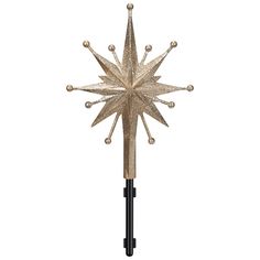 a gold and black snowflake on a white background