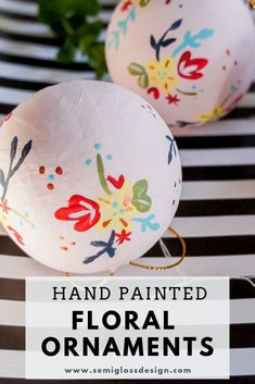 hand painted floral ornaments on black and white striped tablecloth with text overlay that reads, hand painted floral ornaments