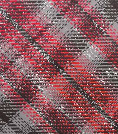 a red and black plaid pattern on fabric