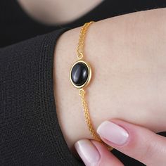 This silver black onyx bracelet will be a perfect gift as a christmas for your best friend. Black onyx bracelet with made of gold plated 18 karat. 925 sterling silver. Minimalist black onyx will be a best gift idea for your mom or your loved ones as a birthday gift or anniversary gift.A perfect Christmas gift as a handmade jewellery.You will add light to your elegance with this handmade crafted ring model, modern look and design with diamond craftsmanship quality. A beautiful minimalist piece to Stone Bracelet Gold, Black Stone Bracelet, Dainty Gold Bracelet, Black Stone Ring, Black Onyx Bracelet, Gold Bride Jewelry, Onyx Jewelry, 925 Silver Bracelet, Simple Bracelets