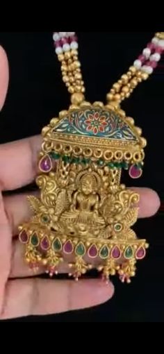 Experience the divine beauty and cultural significance of India with our Goddess Laxmi pendant necklace. Crafted with intricate detail and cultural significance in mind, this necklace features a stunning Laxmi pendant, representing prosperity and success. Elevate your style and connect with ancient traditions with this traditional Indian jewelry piece. Filigree Pendant Amulet Necklace, Traditional Long Bridal Necklace As Gift, Kundan Pendant Necklace For Diwali, Filigree Jewelry For Puja And Festivals, Festive Filigree Jewelry For Puja, Traditional Flower Pendant Jewelry For Wedding, Long Necklaces For Rituals And Festivals, Temple Jewelry Locket For Wedding, Traditional Wedding Jewelry With Flower Pendant