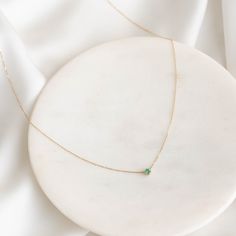 Our Amalie Necklace features an elegant emerald pendant on a 14k gold chain—a timeless addition to any jewelry collection! 


Lab grown emerald pendant measures 3mm in diameter

Necklace has an adjustable length and can be worn at 16", 17" and 18" Minimalist Emerald Necklace In Yellow Gold, Elegant Green Solitaire Necklace For May Birthstone, Green 14k Gold Necklace With Adjustable Chain, Classic Green Emerald Necklace In 14k Gold, 14k Gold Emerald Birthstone Necklace, Elegant Green Solitaire Necklace With Birthstone, Fine Jewelry: Yellow Gold Emerald Necklace With Delicate Chain, Green Emerald Necklace With Adjustable Chain, Elegant Emerald Necklace With Cable Chain As Gift