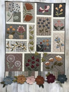 a patchwork quilt with flowers on it and the words felt patch ateler's booth