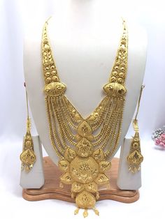 Handmade Indian Jewelry Asian Wedding Bridal Jewellery Party Ethnic Wear 22ct Gold Plated Bridal Necklace Set Rani Haar Bridal Jewellery Set  PLEASE NOTE, This Item Is Not Real Gold .Only Good Quality Gold Plated Jewellery .it is Artificial Jewellery.  It is a perfect match with formal attire on special occasions or with casual wearing.  Slight Colour variations possible due to difference in screen and photograph Care instructions Keep Jewellery away from direct heat, water, perfumes, deodorants Gold Temple Jewelry Tikka With Cutdana, Gold Cutdana Temple Jewelry Tikka, Ceremonial Gold Jewelry With Zari Work, Gold Cutdana Tikka Temple Jewelry, Traditional 22k Gold Tikka, Ceremonial 22k Gold Jewelry Sets For Festivals, Gold Bollywood Traditional Wear For Eid, Bollywood Style Gold Traditional Wear For Eid, Gold Plated Yellow Gold Bridal Necklace For Puja