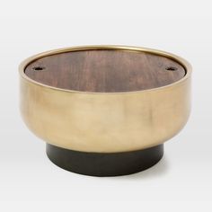 a wooden and metal bowl on a white background