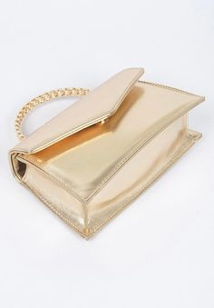 This Metallic Gold Vegan Leather Purse is a show-stopping powerhouse that will transform any look! Featuring a removable cross-body strap and a chic chain strap that turns it into a handbag, this handbag puts the "fun" in function. It's 8.5” x 5” x 2” of gold-plated Plyutherane and mixed material perfection. You'll shine brighter than a disco ball with this statement-making purse! Gold Flap Bag With Gold-tone Hardware For Evening, Trendy Evening Flap Bag With Adjustable Strap, Chic Gold Evening Bag With Adjustable Strap, Party Clutch Shoulder Bag With Adjustable Strap, Gold Crossbody Shoulder Bag With Chain Strap, Gold Flap Bag With Detachable Strap For Formal Occasions, Trendy Gold Shoulder Bag For Formal Occasions, Gold Formal Flap Bag With Detachable Strap, Formal Gold Flap Bag With Detachable Strap