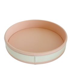 a round pink and white tray on a white background