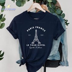 Paris France Shirt, Travel To France Shirt, Paris Tshirt Women, Paris Trip TShirt, Eiffel Tower Shirt, Womens Paris Shirts, France Souvenir This shirt features Paris, France along with the Eiffel Tower and the text "Symbole D'amour" which is french for Symbol of Love . The perfect gift for any women who have been or will travel to France for a trip. DISCLAIMER * Colors in listings may slightly vary depending on what device you are using * Prints may appear smaller depending on the shirt size ord Paris Theme Shirts, Paris Shirts, Paris Tshirt, Travel To France, Travel Tshirt, Paris Shirt, Paris Trip, Tshirt Women, Paris Travel