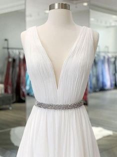 a white dress on display in a store