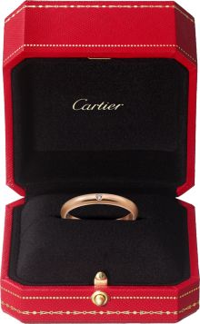 a cartier ring in a red box with gold lettering on the front and bottom