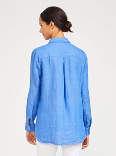 Scoop up our airy linen shirt with a high-low hem and slightly more relaxed fit. We feel a bit more loosened up just looking at it. PS This style is available in additional sizes! | Long sleeve Button front High-low hem 100% Linen Hand wash cold. Lay flat to dry. Size & Fit 29.5" long from top of center back (size M) Model is 5'9" and wearing a size XS | Classic yet contemporary, J. McLaughlin's Britt Linen Shirt is innovatively nostalgic. Free shipping on orders of $150 or more. Classic Blue Blouse With Shirttail Hem, Blue Blouse With Spread Collar And Relaxed Fit, Classic Blue Shirt For Casual Gatherings, Classic Blue Linen Tops, Blue Linen Shirt, Linen Shirts Women, J Mclaughlin, French Blue, Blue Solid