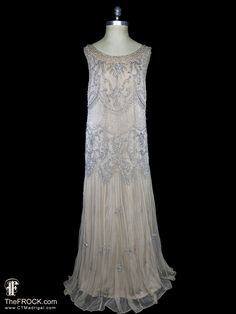 💄After 23 years, our website, TheFROCK.com, has had a makeover. Check out the new site, and join our mailing list for new arrivals.     Vintage Bonwit Teller heavily beaded and sequined sleeveless palest beige/dark ivory net evening gown or wedding dress. Sleeveless, rear zipper, poly jersey lined. The garments has a relaxed 1930s or 1920s flapper style fit that will work for many sizes, the fabric has some stretch: bust will comfortably stretch from 36" to 42", waist stretches from 38" to 41", Gatsby Style Sleeveless Flapper Dress For Gala, Embellished Sleeveless Flapper Dress For Wedding, Sleeveless Embellished Flapper Dress For Wedding, Sleeveless Elegant Flapper Dress For Wedding, Wedding Embellished Sleeveless Flapper Dress, Elegant Sleeveless Flapper Wedding Dress, Wedding Sleeveless Embellished Flapper Dress, Elegant Sleeveless Wedding Flapper Dress, Art Deco Sleeveless Dress For Vintage Events