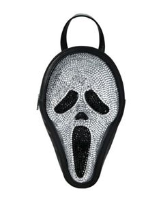 Any horror fan will be sure to scream once they get a look at this officially licensed Ghost Face Bling Mini Backpack. Carry your essentials in style with this blinged out version of Ghost Face's mask and you'll be looking dazzling at the next function. Officially licensed Adjustable Zipper closure Dimensions: 14" H x 9" W x 4" Material: Leather, polypropylene Care: Spot clean Imported Ghost Face is a registered trademark of Fun World Div., Easter Unlimited Inc. Ghost Face protected under worldwide copyright registration and is the exclusive property of Fun World Div., Easter Unlimited Inc. All Rights Reserved. Ghost Face Mask, Horror Merch, Fun World, Ghost Face, Ghost Faces, Mini Backpack, Hot Topic, Scream, In Style