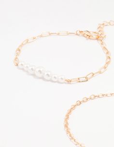 Add charm to your look with this set of four gold paperclip and chain bracelets. Featuring elegant pearl styles, playful paperclip designs, and delicate chain styles, mix and match to your heart's content. Dimensions: Length: 15.5 cm Extender: 6 cm | Lovisa Gold Pearl Paperclip Chain Bracelet 4-Pack Chain Bracelets, Delicate Chain, Gold Pearl, Paper Clip, Mix And Match, Chain Styles, Chain Bracelet, Bracelet, Chain