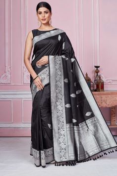 Shop black Banarasi sari online in USA with silver zari border. Look your best on festive occasions in latest designer sarees, pure silk saris, Kanchipuram silk sarees, handwoven sarees, tussar silk saris, embroidered sarees from Pure Elegance Indian fashion store in USA.-full view Black Art Silk Pre-draped Saree With Zari Weaving, Black Pre-draped Saree With Zari Weaving For Puja, Black Handloom Pre-draped Saree For Puja, Black Art Silk Blouse Piece For Eid, Black Banarasi Silk Blouse Piece For Eid, Black Art Silk Saree, Black Katan Silk Blouse Piece With Traditional Drape, Black Pre-draped Saree With Traditional Patterns, Elegant Black Art Silk Saree