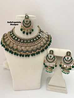 a set of green and white jewelry on display