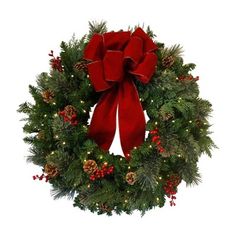 a christmas wreath with red bow and pine cones