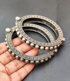 You will receive Set of  2 Pcs Floral Motif Oxidized Silver Bangle Bracelet (kada) Openable Handcrafted Vintage Style Antique Look Indian Traditional Jewelry Metal: Brass Bangle Width : 10 mm inner diameter: 2.2" Approx.   Thank you very much for visiting ! Any questions, please feel free to contact us. Discount for bulk provide. Silver Bangle Bracelet, Brass Bangle, Jewelry Metal, Indian Traditional, Silver Bangle Bracelets, Silver Bangle, Traditional Jewelry, Oxidized Silver, Jewelry Silver