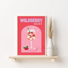 a pink poster on a shelf next to a white vase with a plant in it