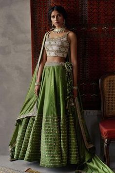 Olive green lehenga with striped pattern hem. Comes with gota-marodi worked blouse and embroidered dupatta.
Component: 3
Embroidered
Neckline: U Neck
Sleeve Length: Sleeveless
Fabric:  Silk
Color: Green
Tassel dupatta
Kamar latkans - Aza Fashions Reception Lehenga For Bride, Olive Green Lehenga, Green Silk Lehenga, Lehenga For Bride, Punit Balana, Sari Lehenga, Reception Lehenga, Green Lehenga, Gaun Fashion