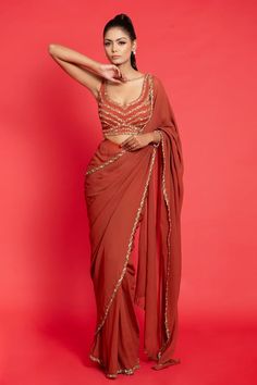 Rust pre-draped saree with embroidered border. Paired with a padded blouse with all over embroidery using dabka, cutdana, and sequin embroidery. - Aza Fashions Rust Color Saree, Rust Orange Saree, Rust Orange Dress, Rust Blouse, Farewell Sarees, All Over Embroidery, Golden Saree, Bridal Sari, Draped Saree