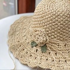 a close up of a straw hat on a table