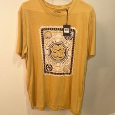 Lucky Brand Tee. Men’s Large. Made From Soft Cotton . New With Tags. Mustard Short Sleeve T-shirt With Graphic Print, Gold Short Sleeve Cotton Shirt, Gold Cotton Short Sleeve Shirt, Yellow Cotton Shirt With Screen Print, Casual Yellow Shirt With Letter Print, Gold Casual T-shirt With Screen Print, Casual Gold T-shirt With Screen Print, Casual Gold T-shirt For Summer, Gold Casual Short Sleeve Top