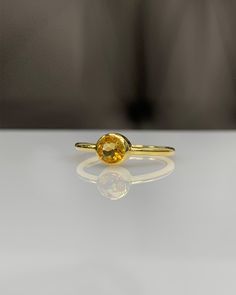 Natural Citrine Bezel Setting Ring * 14K Solid Gold * Genuine Gemstone * Best Gift for her * Handmade Ring ◎ Details ◎ ○ Gemstone Details .Natural CITRINE Round Cut 4.00 mm approx. 0.35 ct ○ Gold Details 14K Solid Gold Width of Band : 1.60 mm Weight of Ring : approx 2.20 gr Made to Order HANDMADE ITEM ○ Upgrade to Solid 18K Gold, please click the link below: https://www.etsy.com/listing/962826004 ○ CITRINE Rings : https://etsy.me/3hAkBKI All of our jewelleries are designed, created and manufactu Gold Yellow Sapphire Ring Gift, Gold Faceted Birthstone Ring For Anniversary, Yellow Sapphire Ring In Yellow Gold As Gift, Yellow Gold Citrine Birthstone Ring For Gift, Yellow Gold Citrine Birthstone Ring As Gift, Gold Sapphire Promise Ring With Faceted Detail, Gift Yellow Sapphire Birthstone Ring, Bezel Set Sapphire Ring Gift, Gift Sapphire Ring With Bezel Setting And Round Band