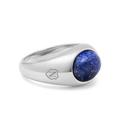 The Silver Oval Signet Ring with Blue Lapis by Nialaya is a luxurious fusion of elegance and sophistication. With its polished blue lapis gemstone set in sophisticated silver, it exudes timeless style and refinement. Whether worn for special occasions or as a daily accessory, this ring is sure to make a statement and become a cherished heirloom. Ring in Stainless Steel Blue Lapis Stone Timeless Blue Signet Ring With Polished Finish, Timeless Sterling Silver Rings For Everyday Luxury, Modern Sapphire Ring Oval Cabochon Polished Finish, Timeless Blue Oval Cabochon Jewelry, Modern Sapphire Ring With Oval Cabochon And Polished Finish, Timeless Blue Gemstone Signet Ring, Elegant Sapphire Signet Ring With Polished Finish, Luxury Tanzanite Jewelry With Polished Finish, Elegant Blue Oval Cabochon Signet Ring