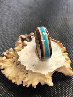 A one of a kind ring for any outdoor enthusiast/hunter! This is a hand turned antler ring cut from a wild whitetail antler shed with cocobolo outer accents with a beautiful Turquoise inlay. Cocobolo is known for hardness and beauty, and it really shows in this ring! Each ring will have similar characteristics to this ring but will be unique in its own sense as no two pieces of antler are the same. For other rings made from antler or wood please visit other items in my shop: https://www.etsy.com/ Unique Brown Jewelry With Inlay, Artisan Brown Inlay Jewelry, Adjustable Turquoise Ring With Inlay For Gift, Deer Antler Crafts, Ring Cuts, Antler Crafts, Antler Ring, Bone Horn, White Tail