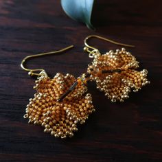 Heart in Hawaii Beaded Hibiscus Earrings - Mango and Gold Traditional Gold Flower Earrings, Adjustable Gold Beaded Flower Earrings, Gold Flower Jewelry With Tiny Beads, Gold Flower-shaped Jewelry With Tiny Beads, Gold Floral Jewelry With Tiny Beads, Gift Flower Earrings With Tiny Beads, Gift Flower Earrings With Tiny Round Beads, Traditional Gold Flower Earrings With Ear Wire, Traditional Gold Earrings With Tiny Beads