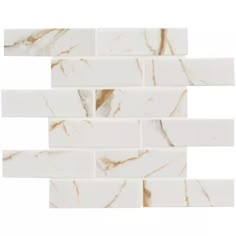 white marble tile with gold veining on the edges and one side that is very thin