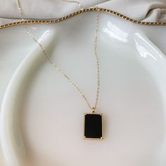 "HIGH QUALITY 14k GOLD FILLED BLACK ONYX NECKLACE | Dark Matter Black Onyx Necklace | gold filled | layering necklace | tag pendant | 14k gold | 18k gold | cable chain | herringbone | natural gemstone *FREE SHIPPING* * tarnish resistant, lead and nickel free necklaces * * Buy the set and get 8% DISCOUNT * STUDIO TWENTY NINE \"DARK MATTER\" NECKLACE SET DETAILS: Materials & Style: * Closure: Lobster clasp * Black onyx natural gemstone set in 14k gold filled rectangle pendant on 14k gold fille Everyday Jewelry With Rectangular Gemstone Pendant, Everyday Jewelry With Rectangular Clavicle Chain Pendant, Dainty Rectangular Clavicle Chain Pendant, Black Gold-plated Adjustable Chain Jewelry, Everyday Square Pendant Clavicle Chain Jewelry, Everyday Square Pendant Clavicle Chain, Elegant Black Clavicle Chain Charm Necklaces, Minimalist Jewelry With Delicate Rectangular Chain, Everyday Clavicle Chain With Square Pendant