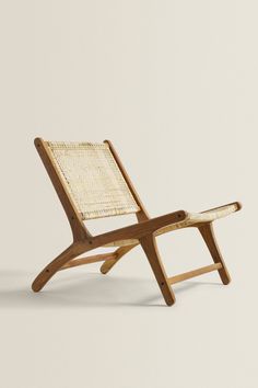 a chair made out of wood and wicker on a white background with no one in it