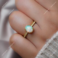 Gemstone : Natural Ethiopian Opal  Metal : 9K Gold / 14K Gold / 18K Gold / 925S Silver Gemstone Shape and Size : Oval 9x7 MM Gemstone Shape and Size : Round 1.50 MM  Gemstone Weight : 2.00 Ctr Metal Weight :  3.30 Gram ACCEPT CUSTOM SERVICE: 1. Accept change main stone type, size : Oval 9x7 MM 2. Accept change other material : This jewelry can also be made in solid gold (14K white/rose/yellow gold...) Please contact me if you have special requests. Thanks for your visiting! Rings Opal, October Birthstone Rings, Jewelry Opal, Birthstone Rings, Opal Band, Ethiopian Opal Ring, Opal Ring Gold, Yellow Gemstones, Rose Yellow