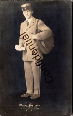 an old photo of a man in uniform holding a bag and looking at the camera