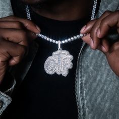 Introducing the GLD x Lil Durk exclusive collaboration- the ‘Only the Family’ Collection. This exclusive pendant is thoughtfully designed to celebrate the Grammy-award winning artist’s presence in rap culture, deeply embedded in music and style. The OTF Paint Logo Pendant is fully iced out with diamond baguette hand-set stones featuring letters with a Rose Gold border, representing family unity. Pair this piece with the 5mm Diamond Tennis Chain for a set that is guaranteed to inspire and shine. White Bling Necklaces For Streetwear, Luxury Diamond Jewelry For Streetwear, White Bling Jewelry For Streetwear, Luxury Bling Jewelry For Streetwear, Sterling Silver Pendant Necklace For Streetwear, White Pendant Necklace For Streetwear, Iced Out Pendant Necklace For Streetwear, Streetwear Iced Out Pendant Necklace, Iced Out Pendant Jewelry For Streetwear