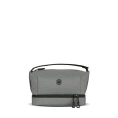 a gray bag with black straps on the side and an open zippered pocket in front