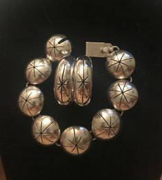 Taxco Mid century Modern Bracelet & earrings set.  Demi parure set.  Starburst design.  1950s 1960s. Space age.  Quintessentially MCM Mexico.  Bracelet: Measures 7 1/2" (7 1/4" wrist) Half dome hollow panels.  7/8" diameter.  Working secure clasp.  Slide in clasp.  Marked: TV-140 Mexico 925.  Hoop Earrings: Measure:  1 3/8" diameter.  1/2" width.  Pierced. French wire.  Marked: TM-159 Mexico 925.  Large but not weighty.  Statement pieces.  Previously owned.  Excellent vintage condition.  I polis Mid-century Polished Formal Jewelry, Mid-century Polished Finish Jewelry For Anniversary, Vintage Silver Hoop Jewelry, Nickel-free Retro Jewelry For Anniversary, Retro Silver Bracelet Jewelry, Retro Nickel Free Jewelry For Anniversary, Retro Silver Bracelet, Retro Sterling Silver Jewelry Gift, Retro Sterling Silver Jewelry For Gift