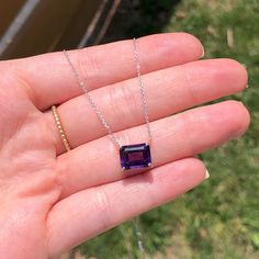 This gorgeous solitaire pendant features an emerald cut 10x8mm amethyst set in a solid 14k white, yellow, or rose gold setting. A perfect birthday gift for February babies, this magnificent purple gemstone will make any outfit sparkle and shine. Let your beauty shine! Choose between a 16" or 18" chain so we can make sure your pendant is perfectly centered! Elegant Asscher Cut Birthstone Jewelry, Fine Jewelry Asscher Cut Gift, Emerald Cut Amethyst Birthstone Jewelry, Faceted Asscher Cut Fine Jewelry, White Gold Birthstone Jewelry With Radiant Cut, White Gold Jewelry With Birthstone In Radiant Cut, White Gold Radiant Cut Birthstone Jewelry, Fine Jewelry White Gold Amethyst With Emerald Cut, Elegant Amethyst Jewelry With Rectangular Stone