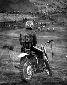 a man riding on the back of a dirt bike