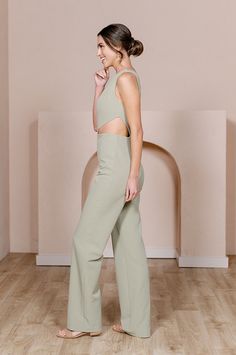 Our Lennon Jumpsuit is now available in all our crepe colors, making it the perfect option for the bridesmaid who desires a unique and edgy alternative to a dress! Lennon is modern and elevated in its design, featuring a one-shoulder draped bodice and a mid-size side cut-out that hits near the waist on the left side with wide straight-leg pants, creating a feeling of effortless beauty. FEATURES: Fitted silhouette One shoulder neckline, thick shoulder strap on the left side Built-in bra cups and Elegant Spring Jumpsuits And Rompers With Back Opening, Fitted Jumpsuits And Rompers For Wedding Guest In Spring, Chic Sleeveless Jumpsuit For Wedding Guest, Sleeveless Spring Wedding Pantsuit, Chic Sleeveless Wedding Pantsuit, Fitted Sleeveless Bridesmaid Jumpsuits And Rompers, Fitted Sleeveless Bridesmaid Jumpsuit, Chic Fitted Maxi Length Jumpsuits And Rompers, Fitted Floor-length Jumpsuits And Rompers For Date Night